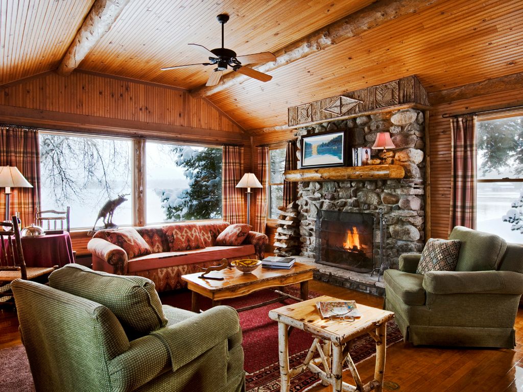 Cozy Fireside Lounge with Stone Fireplace and Comfortable Seating